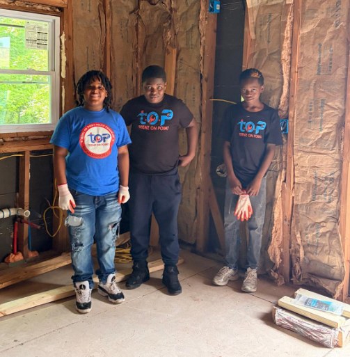 Teenz on Point participants standing inside a real construction environment